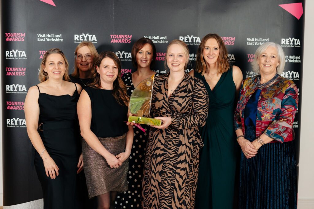 Wold Escapes team winning Remarkable Camping, Glamping & Holiday Park of the Year 2024 REYTA award
